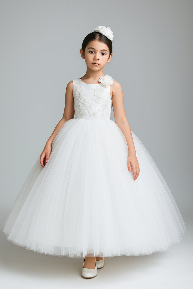 Young girl wearing a white floral dress against a gray background